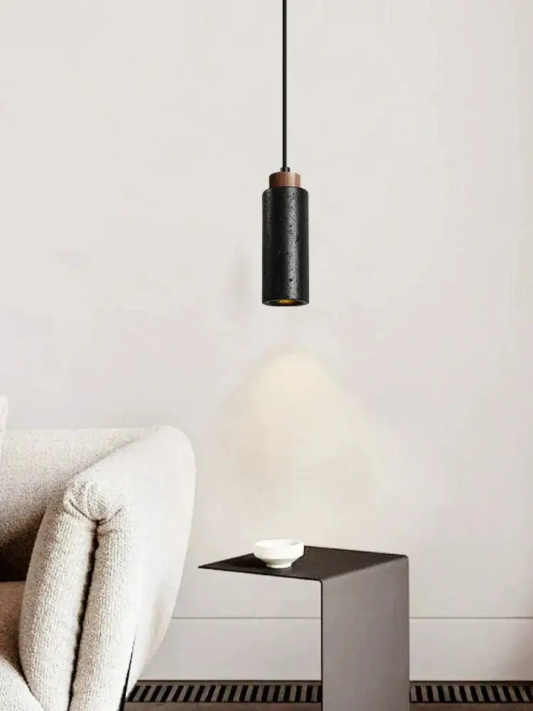 Modern black stone bedside chandelier pendant light with textured black cylindrical shade and wooden top for bedroom decorbites black stone