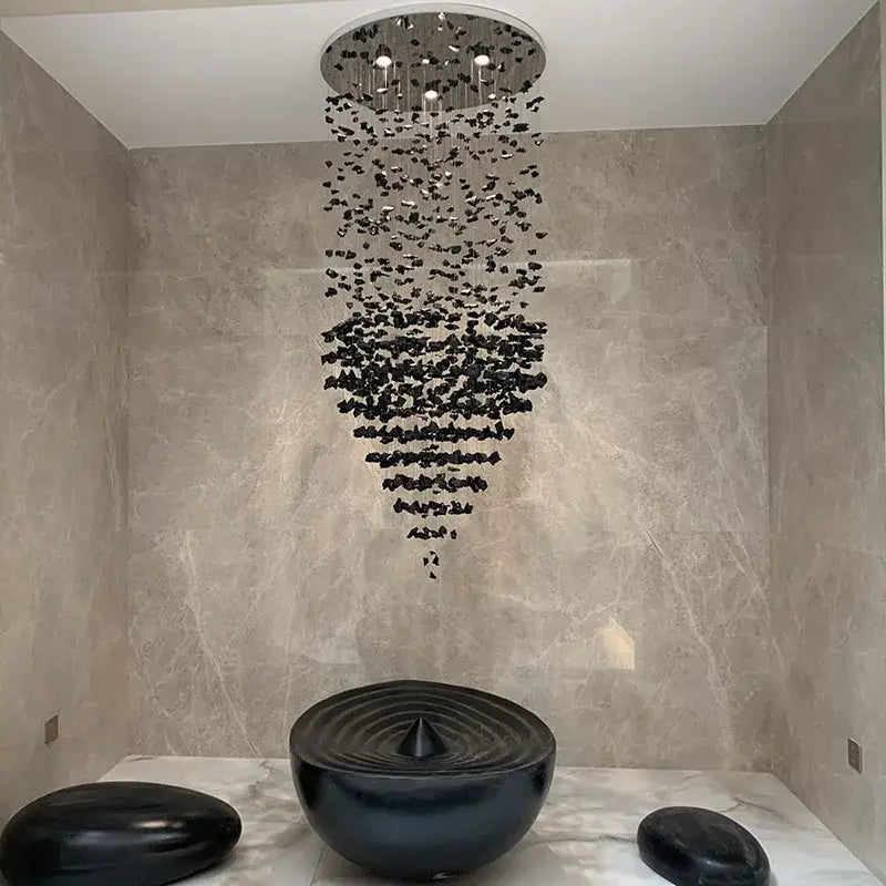 Modern black stone decorbites crystal chandelier showerhead with circular design and cascading water droplets for living space