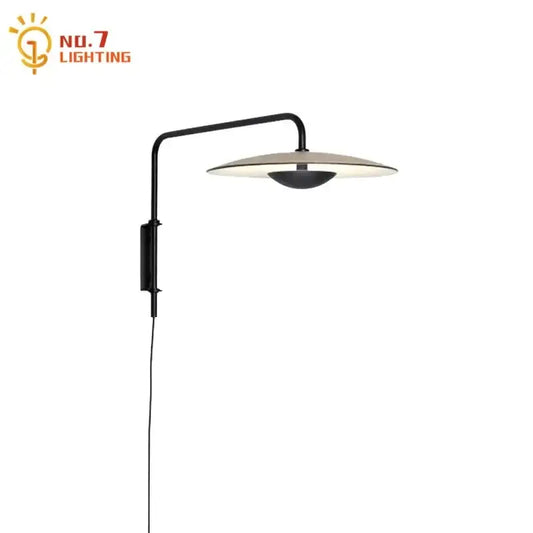 Modern black swing arm wall lamp with sleek curved arm and disc shade iron art decorbites sconce for bedroom decor
