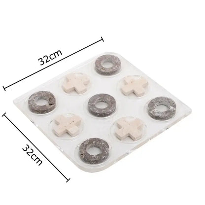 Modern black and tan decorbites acrylic tic-tac-toe chessboard set with gray and off-white stone-like pieces for living room decor