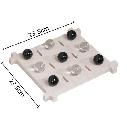 Modern black and tan decorbites acrylic tic-tac-toe chessboard set with light gray stone grid and black clear marbles