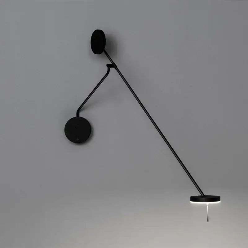 Modern black telescopic wall lamp with articulated arm and circular base emitting soft white light for bedroom decorbites black telescopic wall lamp