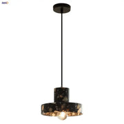 Modern black terrazzo led pendant lamp with gold-toned interior from decorbites for stylish dining room lighting decor