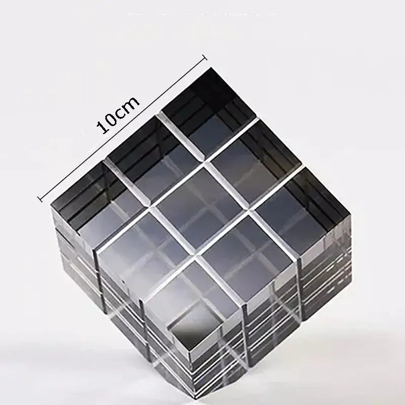 Modern black and transparent crystal magic cube desk ornament with sleek glass sides and grid design for office decor
