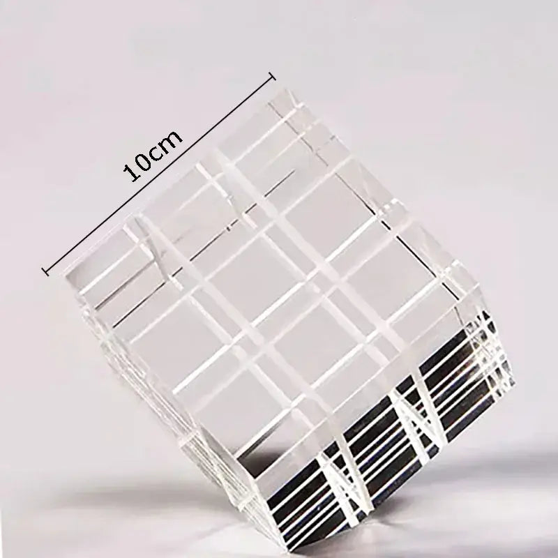 Modern black and transparent crystal magic cube desk ornament with clear acrylic grid pattern and black striped base