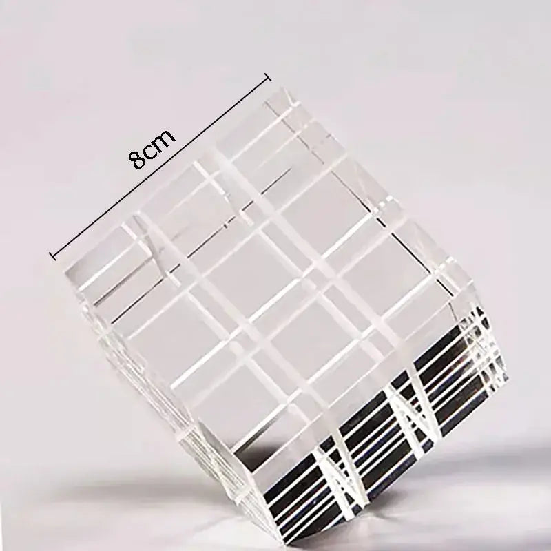 Modern black and transparent crystal magic cube desk ornament made of clear acrylic with grid pattern and black stripes