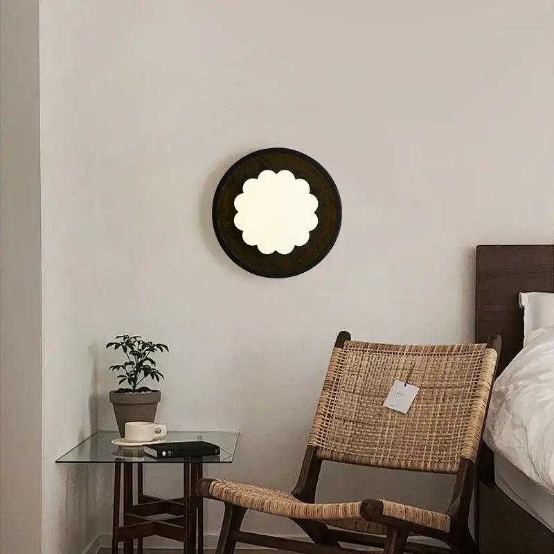 Modern black travertine wall lights featuring a circular scalloped frosted glass center for bedroom decorbites black travertine