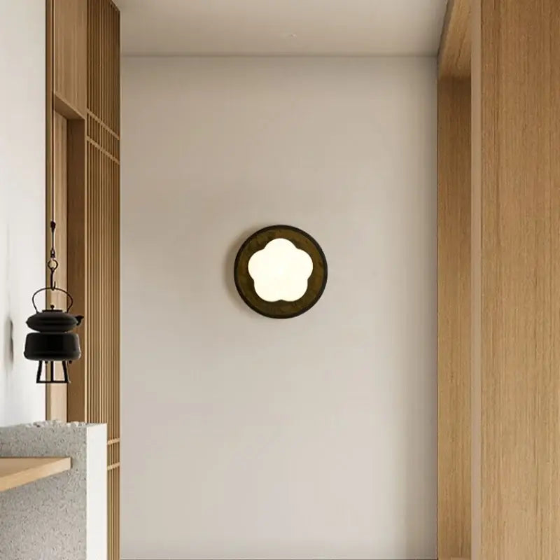 Modern black travertine flower led wall lights with dark bronze frame and cloud-shaped illuminated center for bedroom decorbites black travertine