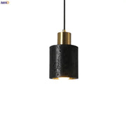 Modern black travertine led pendant light with black textured cylindrical design and brass accent for dining room decorbites black travertine
