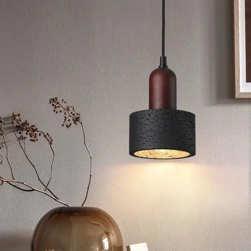 Modern black travertine pendant light with black textured concrete and warm brass interior for bedroom decorbites black travertine