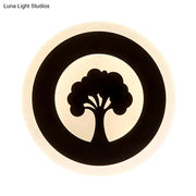 Black circular wall sconce with stylized tree pattern on cream background modern led flush wall bedroom light