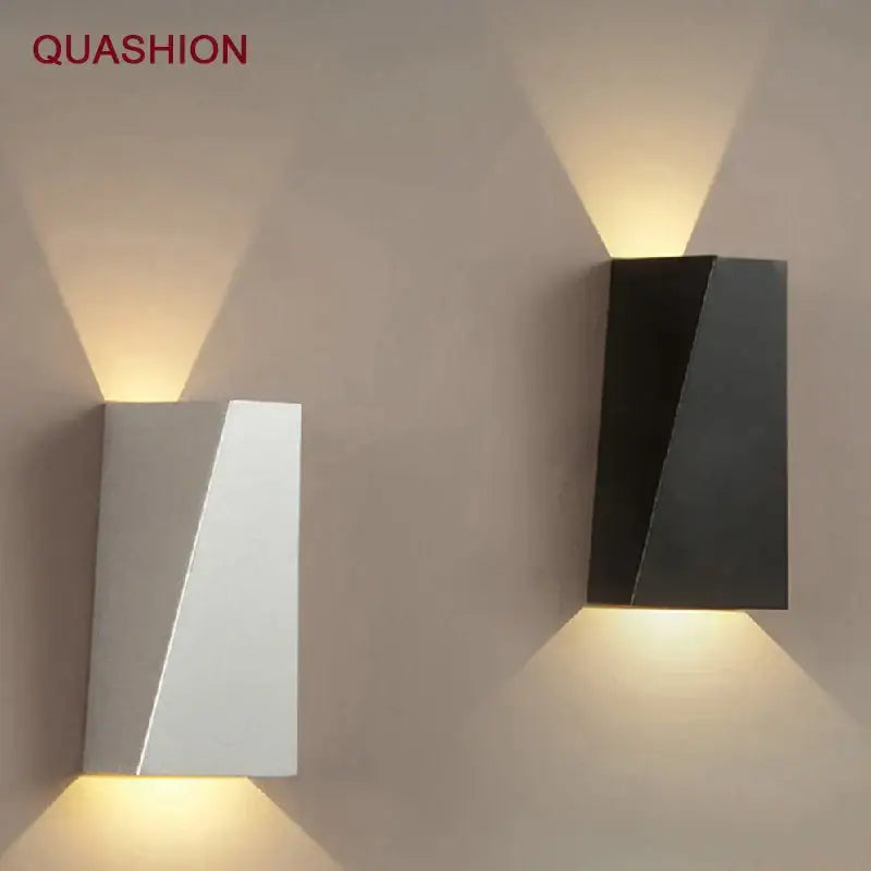 Modern black triangular led wall light with sleek white and matte black finishes and warm ambient lighting decorbites led wall