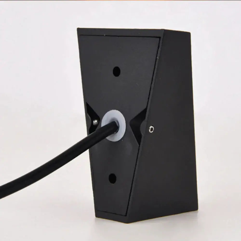 Modern black triangular led wall light with sleek design and central circular opening for cable decorbites led wall light