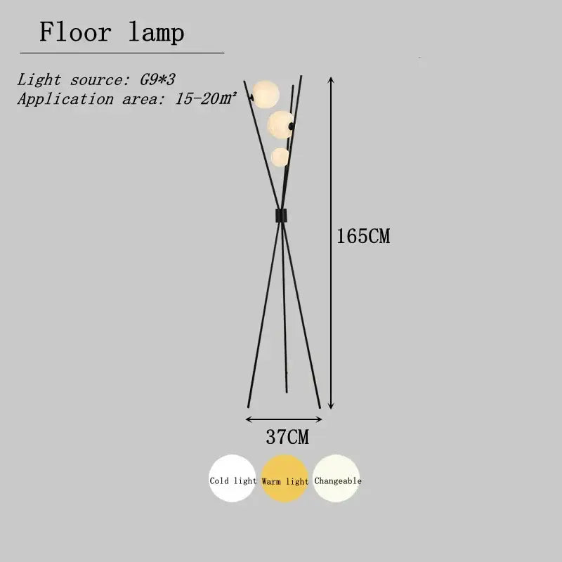 Modern black tripod moon floor lamp with three white spherical g9 bulbs and adjustable warm or cold light settings
