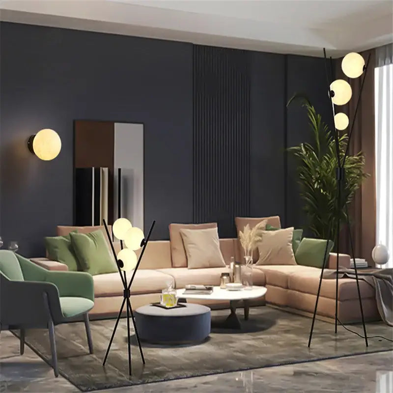 Modern black tripod moon floor lamp with white glass bulbs and sleek metal base for stylish living room decorbites moon floor