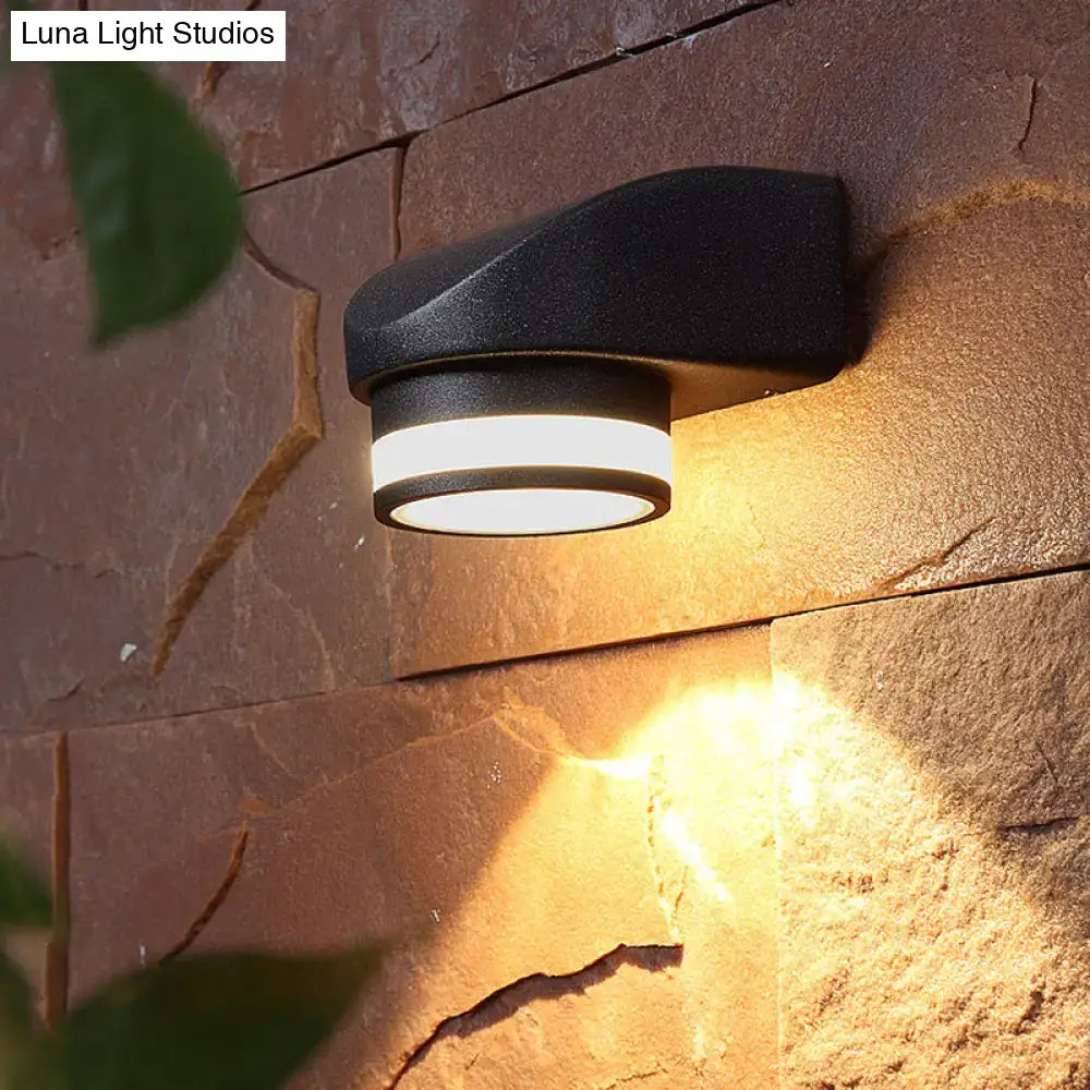 Modern black tubular metal wall washer sconce with sleek curved design and warm white led illumination for outdoor use