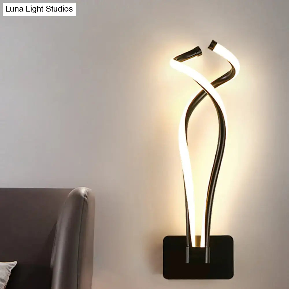 Modern black and white led wall sconce with a sleek twisted spiral design for bedroom lighting