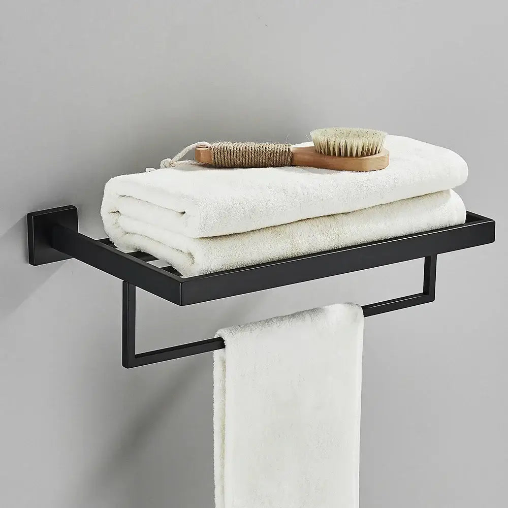 Modern black two tier towel rack with sleek metal design holding white towels and integrated hanging bar decorbites black towel rack