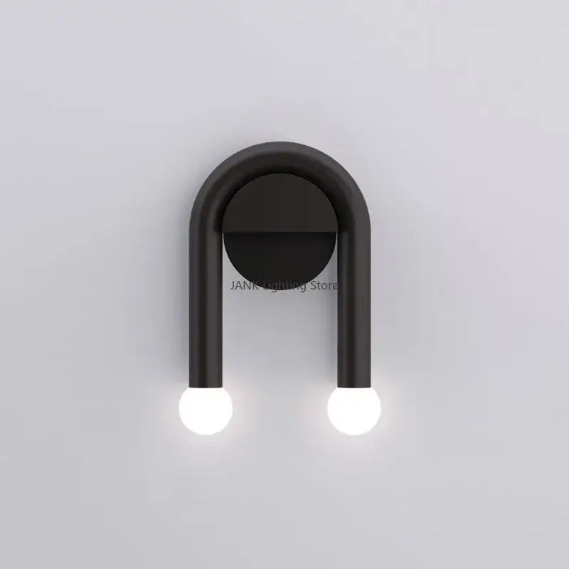 Modern black u-shape led wall lamp with two spherical bulbs designed as an indoor minimalist bedroom sconce