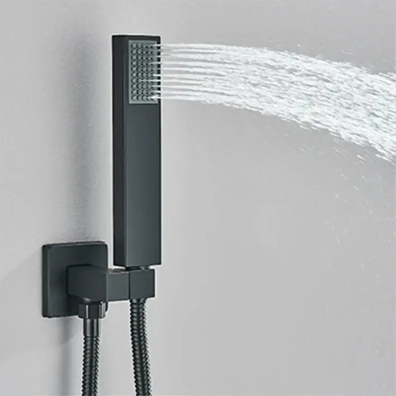 Modern black wall mounted shower system with black matte finish rectangular showerhead emitting rainwater jets