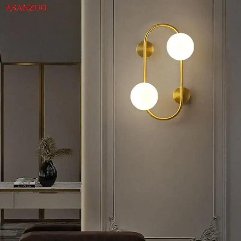 Modern black wall sconce with brass led curved arm and two frosted glass globes for bedroom decorbites brass led wall lighting