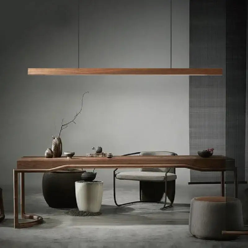 Modern black walnut led pendant light hanging above a sleek minimalist wooden table with elegant curved legs for dining room decorbites black walnut black walnut dining