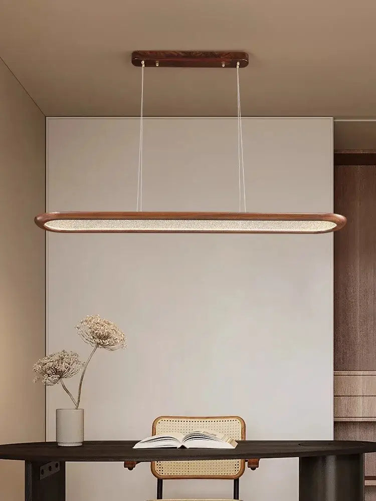 Modern black walnut wooden dining room led pendant lamp with warm brass frame and textured glowing ceiling chandelier decorbites black walnut