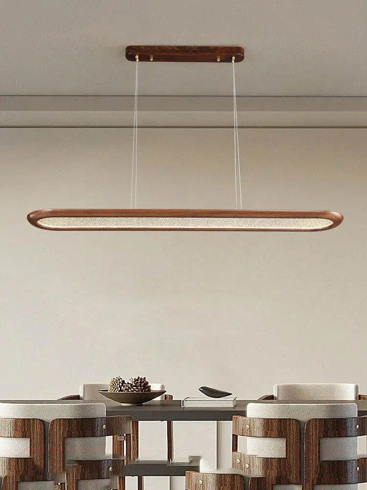 A modern black walnut wooden dining room led pendant lamp with a warm wood finish and diffused glass panel ceiling chandelier