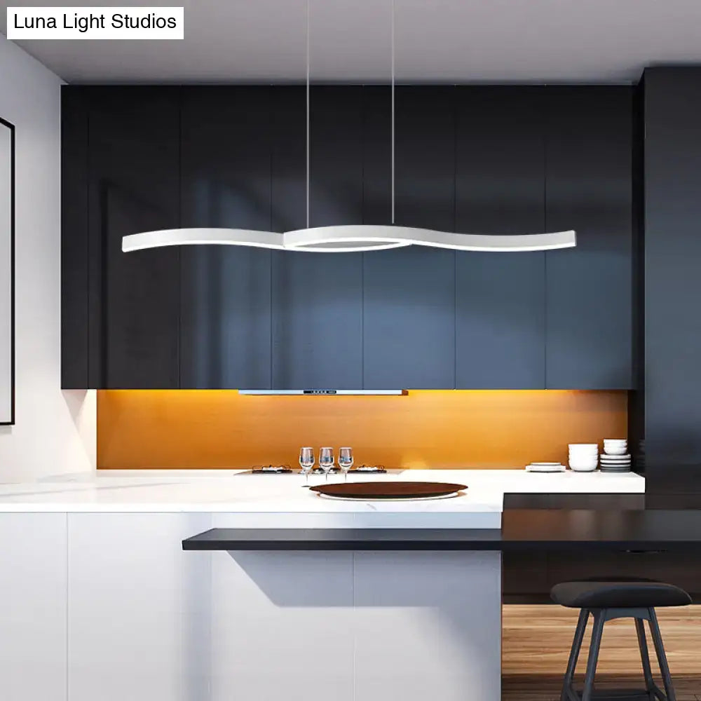 Modern white led hanging light fixture with sleek wavy design above kitchen island for contemporary lighting