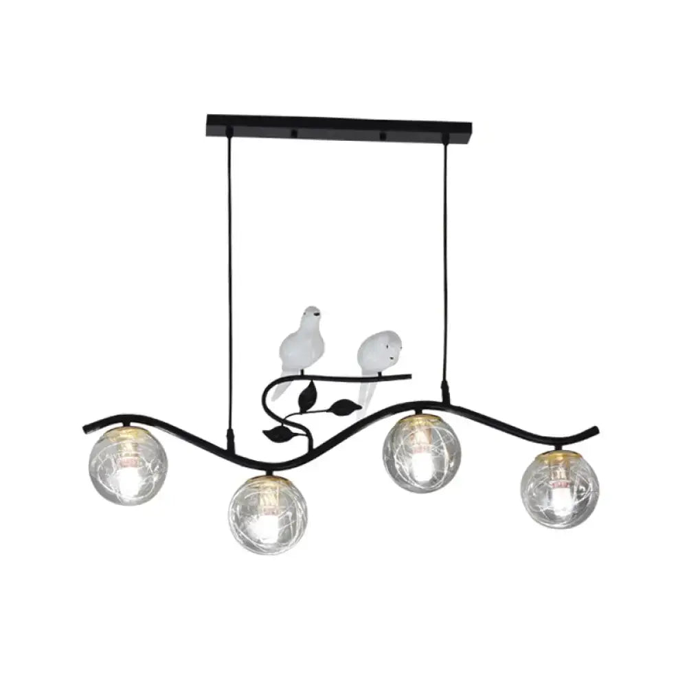 Black wrought iron hanging lamp with three smoke gray clear glass globes and bird decor with bulb included