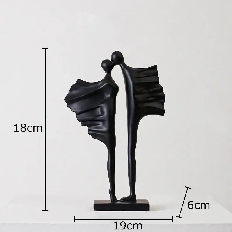 Modern black abstract lovers resin sculpture with flowing wing-like forms and glossy finish for living room decorbites decor