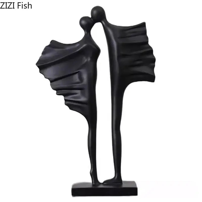 Modern black and white decorbites abstract lovers resin sculpture featuring two stylized figures embracing on a minimalist base