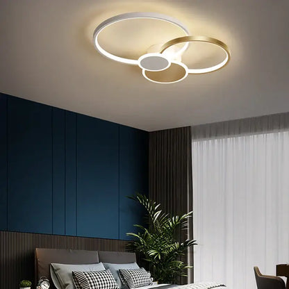 Modern black and white acrylic chandelier light with white and gold interlocking rings for living room ceiling décor