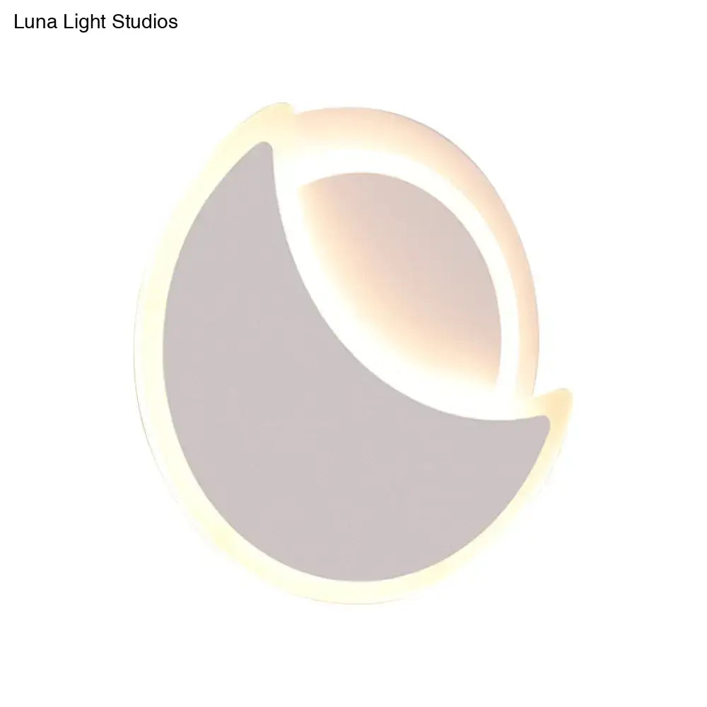 Modern black white acrylic eclipse wall sconce with crescent shape soft warm glow for stylish bedroom lighting