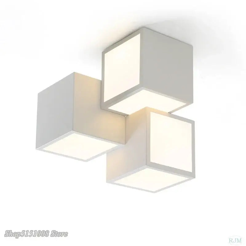 Modern black and white decorbites acrylic led ceiling light with three interconnected geometric cube panels for bedroom decor