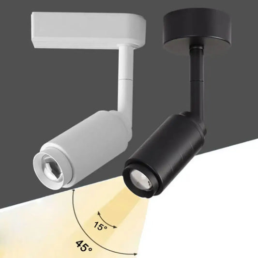 Modern black and white adjustable beam angle track spotlight with cylindrical heads and clear lens covers in matte finishes