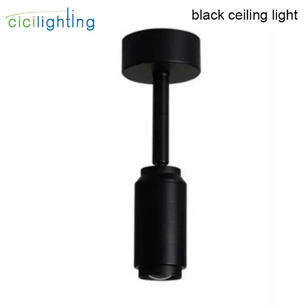 Modern black cylindrical ceiling track spotlight with adjustable beam angle and sleek matte finish for shops and homes