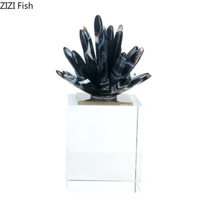 Modern black and white agate flower crystal art sculpture resembling a spiky cactus on clear acrylic pedestal for decor