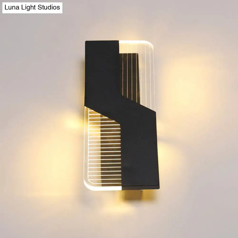 Modern black and white angular led wall mount light featuring sleek vertical light strips for bedroom use
