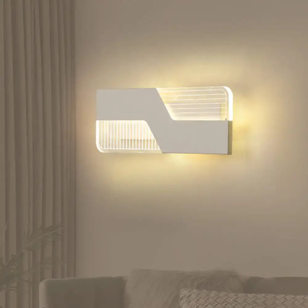 Modern black and white angular led wall mount light with sleek white wall mount and warm ambient lighting for bedroom