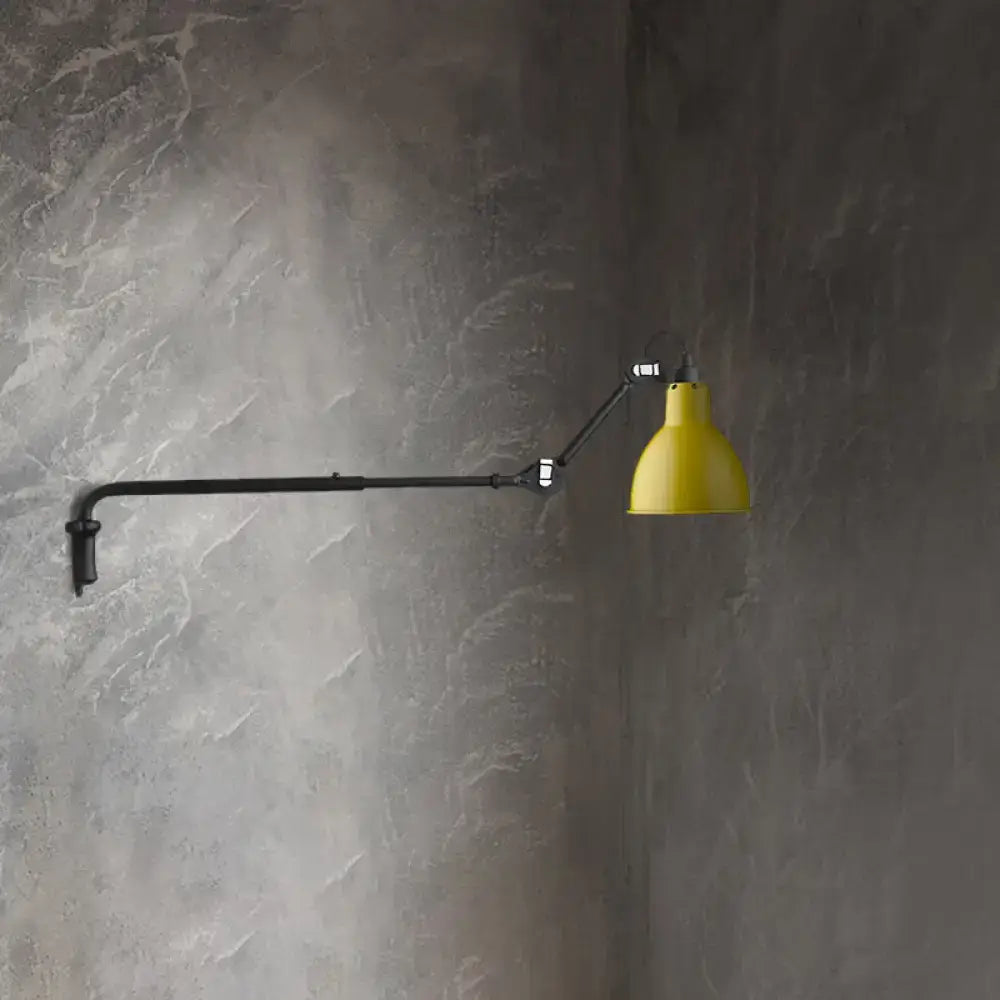 Yellow conical shade wall sconce with black articulated arm for direct wired electric power source use in bedrooms