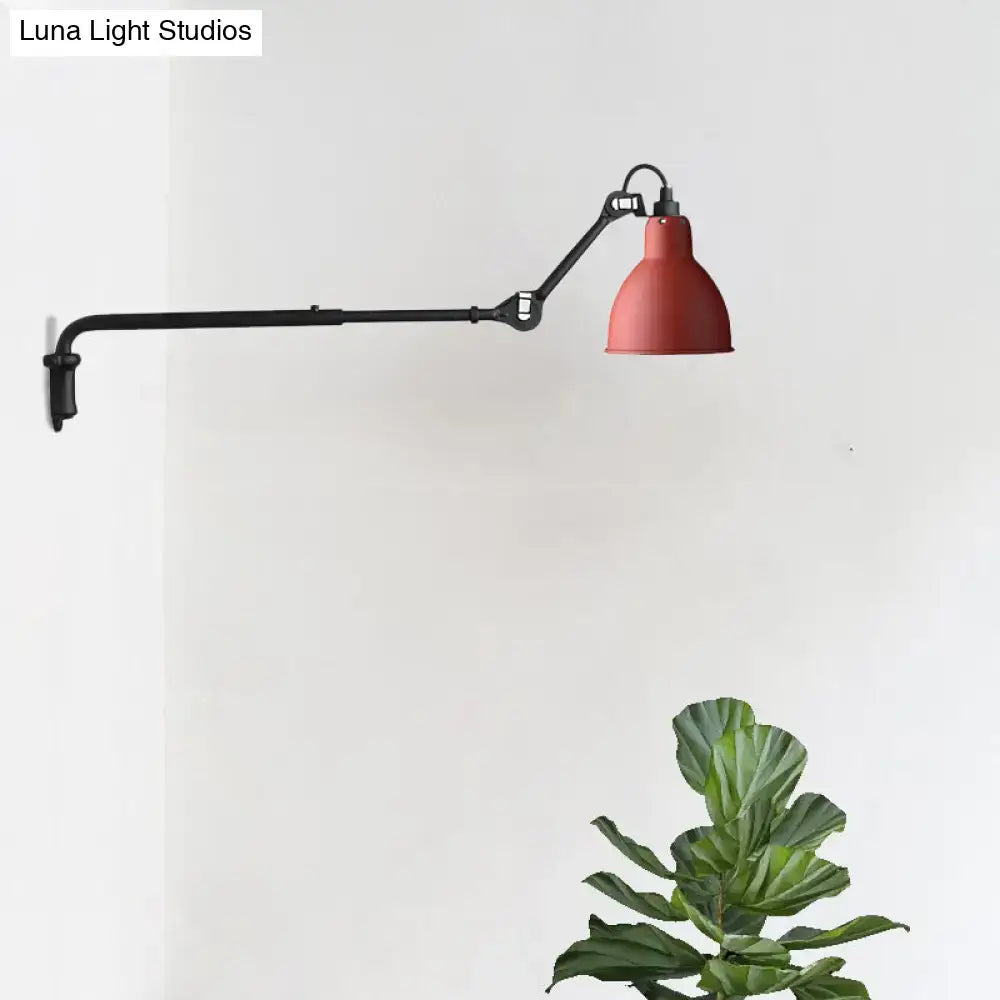 Red industrial-style wall sconce with black articulated arm designed for direct wired electric power in bedroom settings