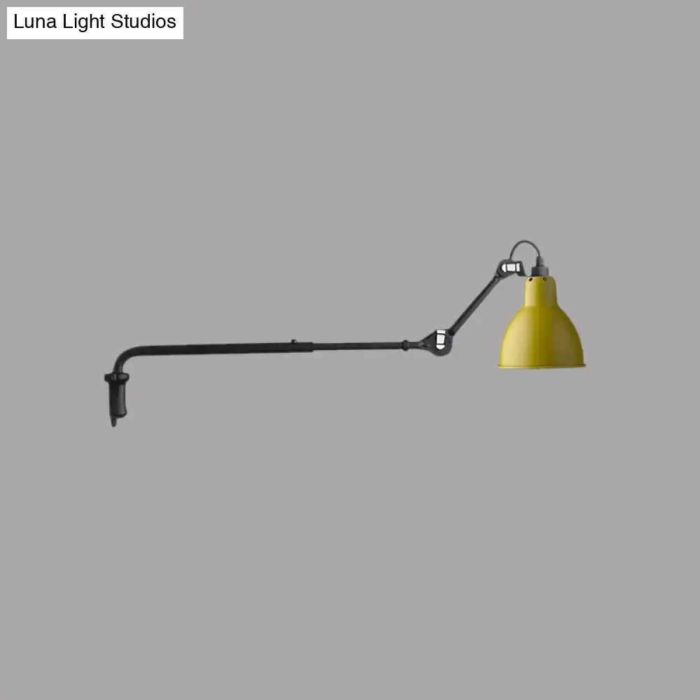 Yellow conical shade on modern black and white articulated bedroom wall lamp with direct wired electric power source