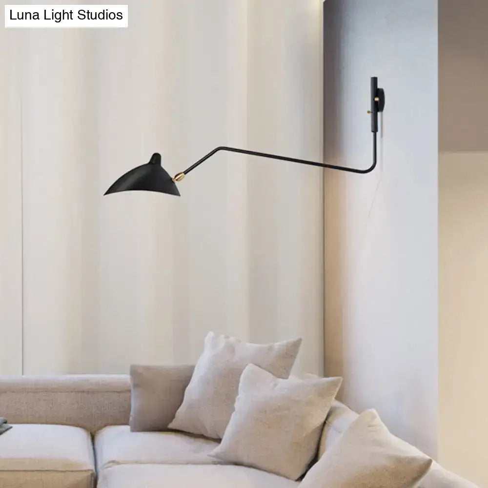 Modern black wall sconce with sleek articulated arm and conical shade for stylish living room light fixture