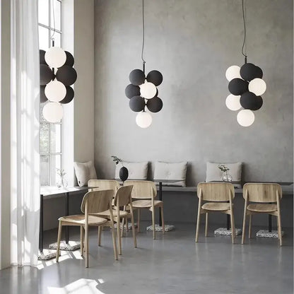 Modern black and white ball led ceiling chandelier featuring spherical pendant lights in a clustered design for kitchen use