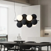 Modern black and white ball led ceiling chandelier with matte finish spherical bulbs arranged in a cluster design