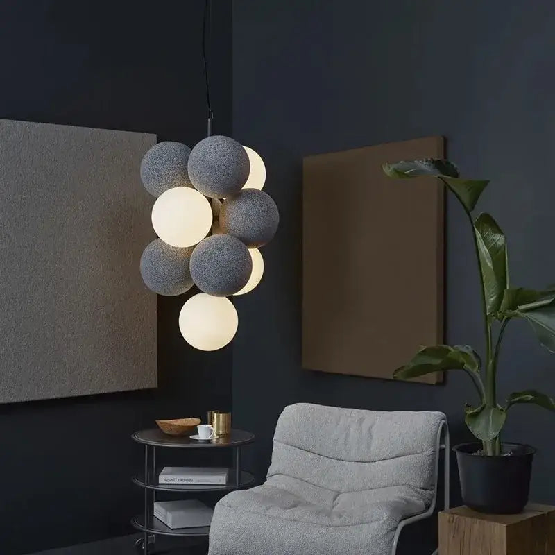 Modern black and white ball led ceiling chandelier with textured gray spherical pendant light and glowing orb cluster
