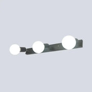 Modern black and white bedroom vanity light with exposed bulbs and three spherical white bulbs wall-mounted design