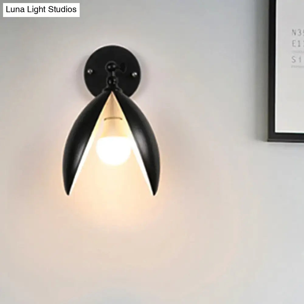 Modern black metal wall light with sleek petal design and warm light for living room blooming bud wall decor