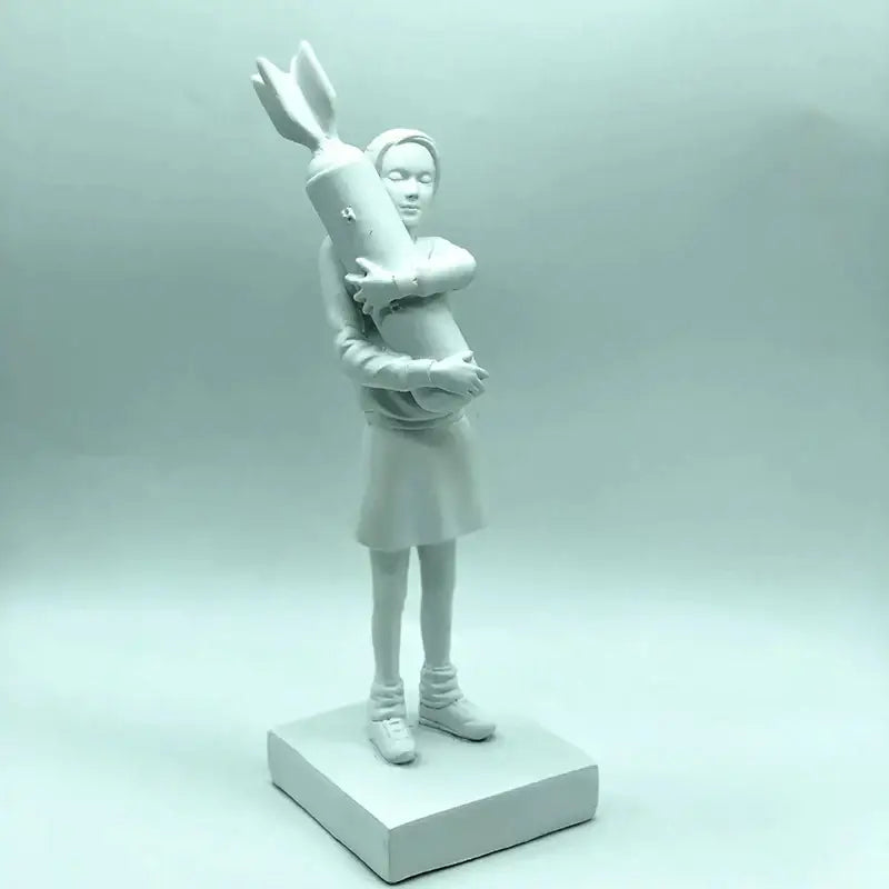 A matte white ceramic bomb hugger girl figurine holding a stylized rocket modern living room decorbites statue